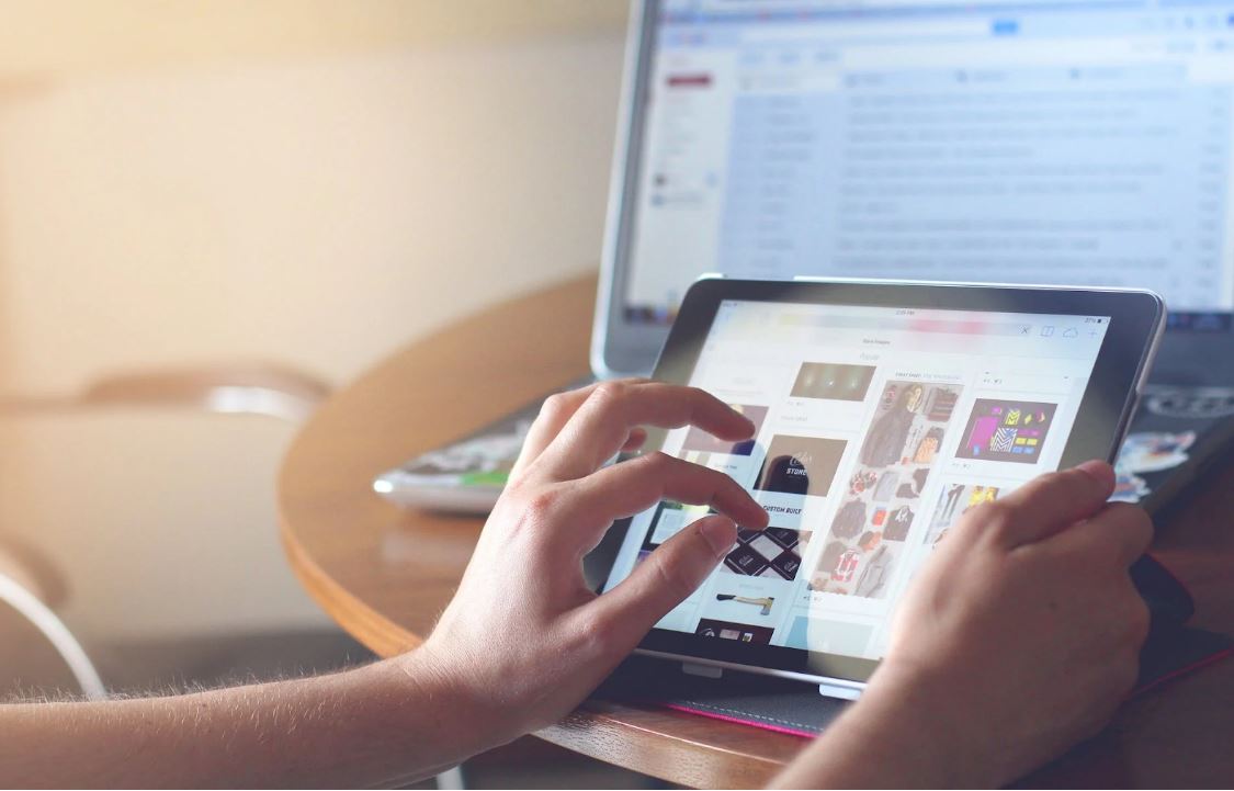 a person browsing images on a tablet